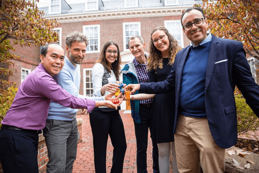 PRME representatives posing with Legos outside.